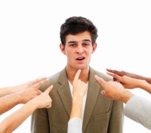 Closeup of human hands pointing towards business man