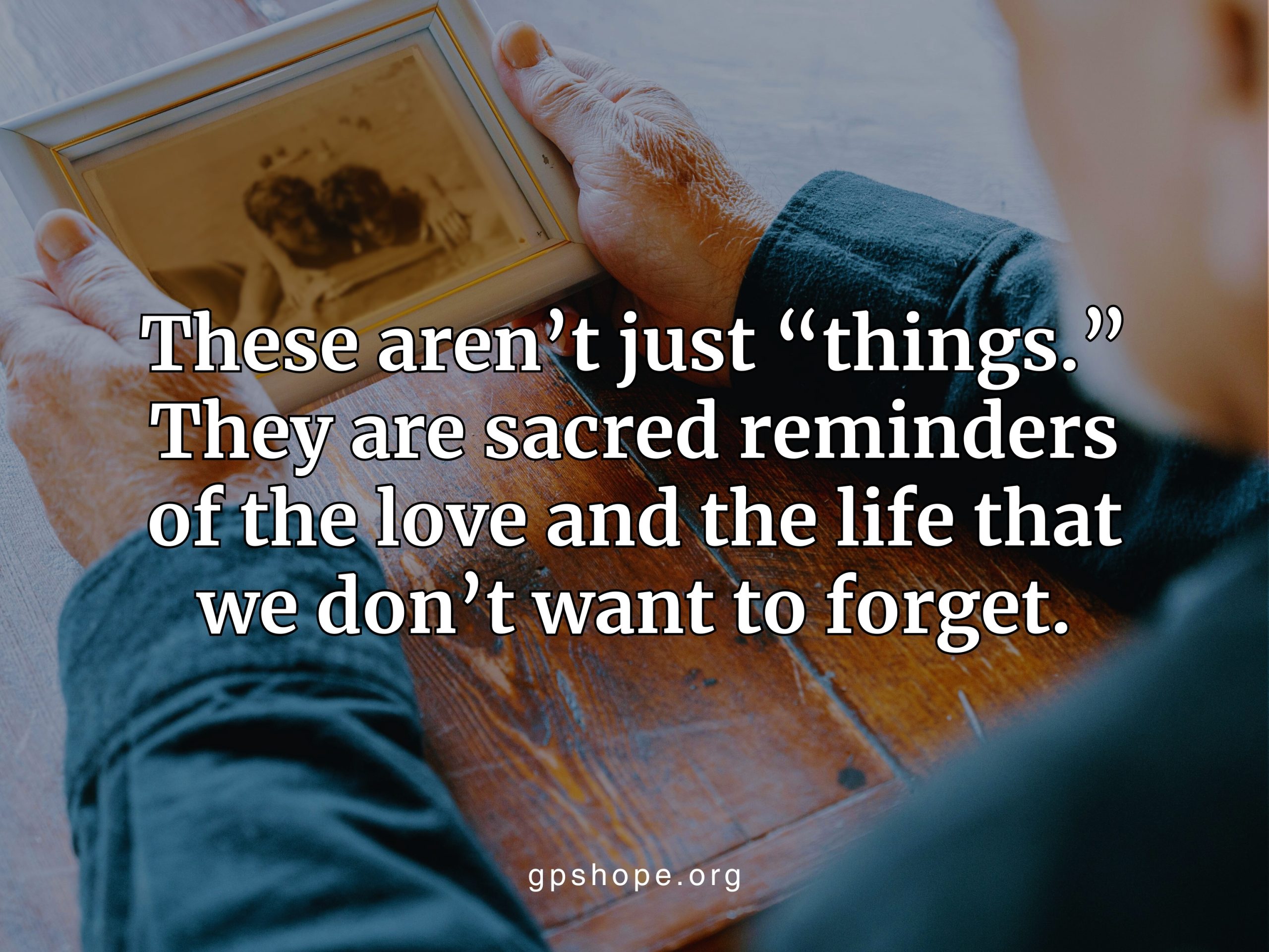 An elderly person holding a framed photo of two children, showing Sacred Reminders of love, life, and the lasting bond after child loss. GPS Hope – Grieving Parents Sharing HOPE.