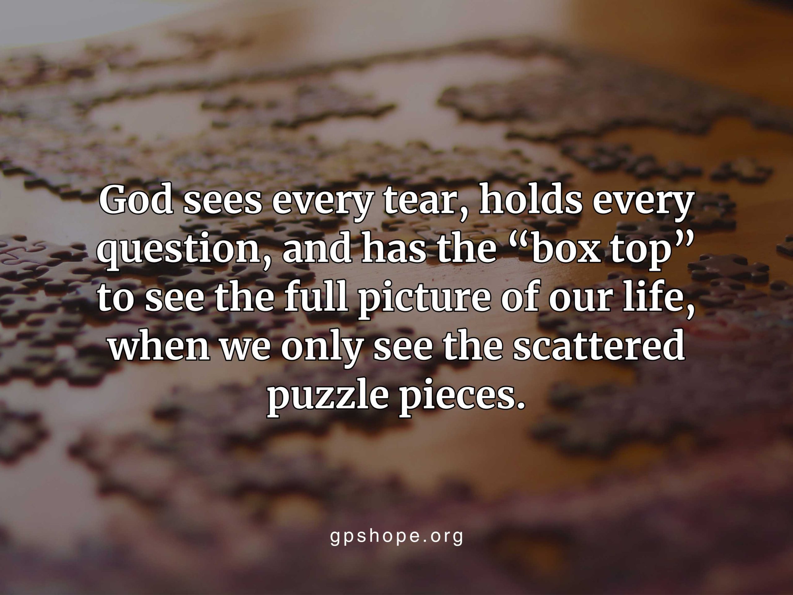 A close-up of scattered jigsaw puzzle pieces on a wooden surface, symbolizing life’s broken moments. The overlaid quote reads: “God sees every tear, holds every question, and has the ‘box top’ to see the full picture of our life, when we only see the scattered puzzle pieces.” A comforting reminder of healing after pregnancy loss — GPS Hope - Grieving Parents Sharing HOPE.